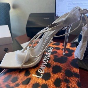Wrap around white clear heel